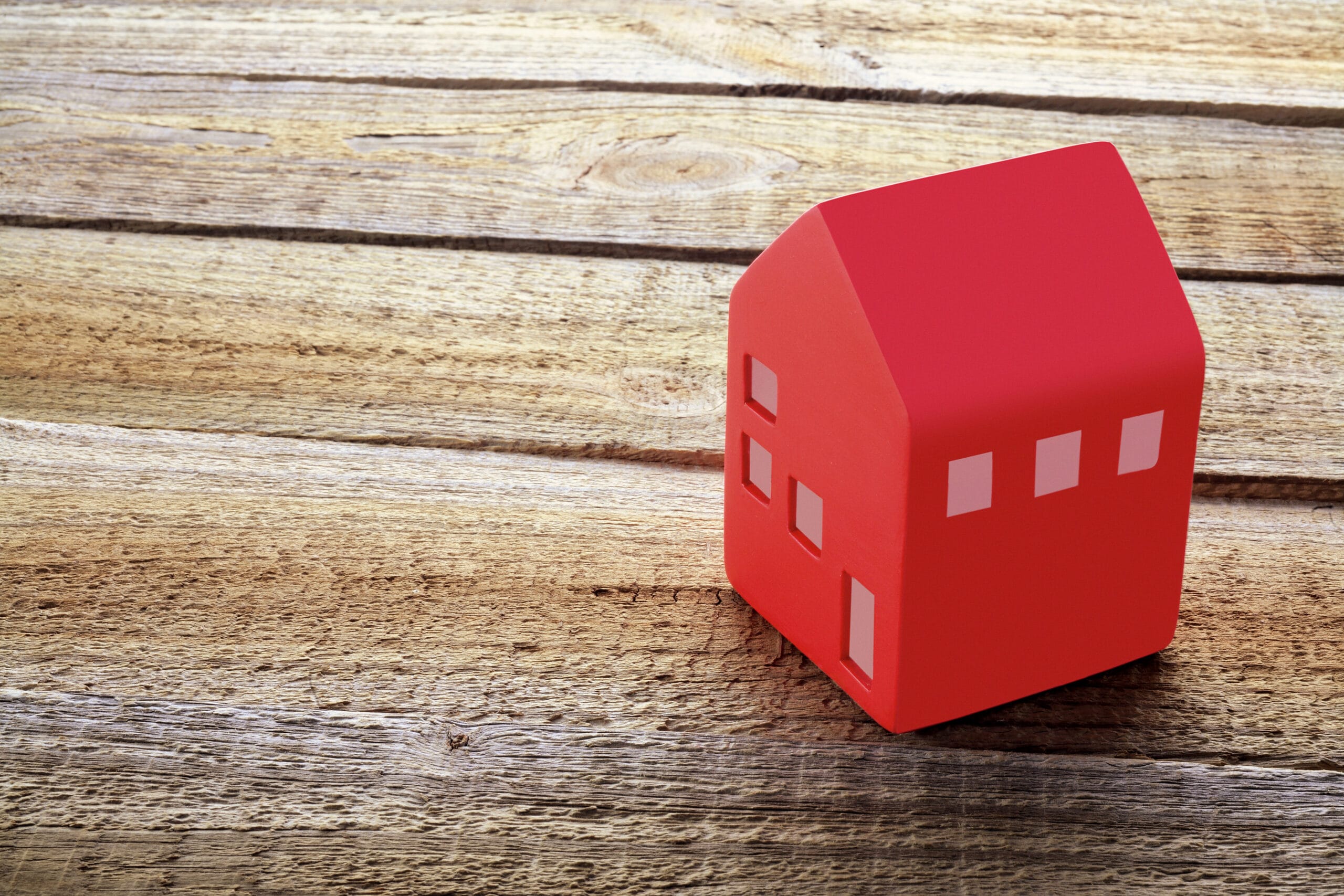 toy house on a wooden table